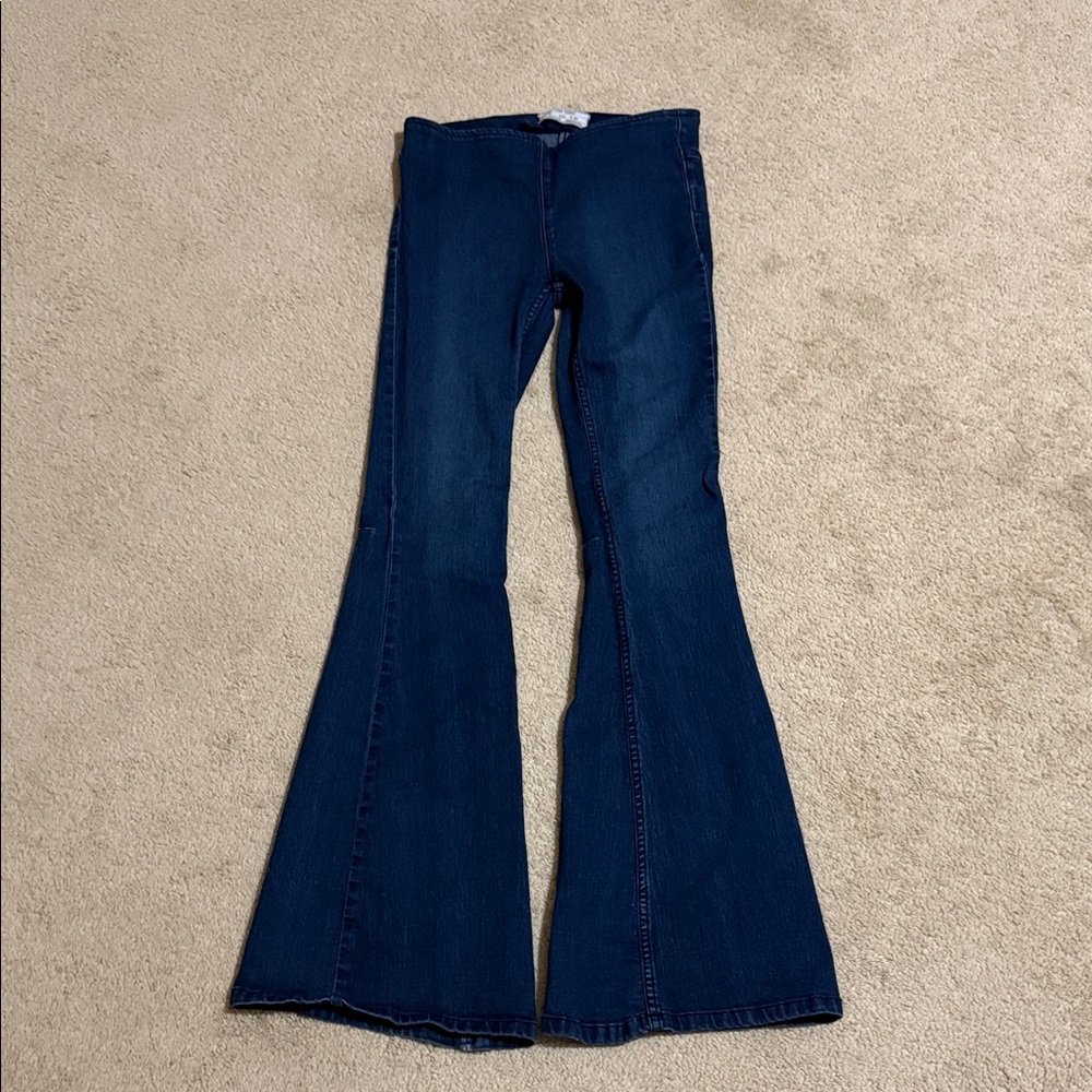 Free People dark washed pull up flares size 26